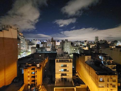 a view of a city at night with buildings at Depa Patio Olmos in Córdoba