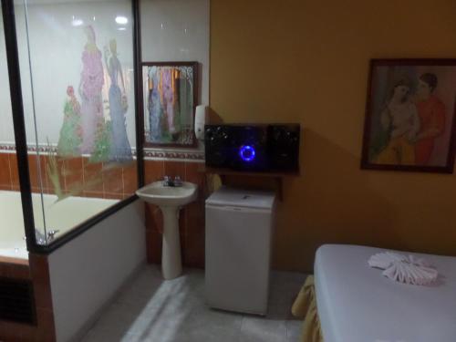 TV a/nebo společenská místnost v ubytování Aparta Hotel Plaza Real Norte