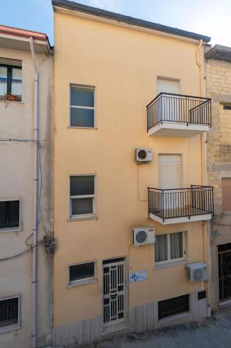 a building with two balconies on the side of it at Halicia Vacanze in Salemi
