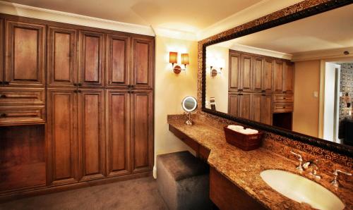 a bathroom with a sink and a large mirror at Seaview, A Dolce Hotel in Galloway