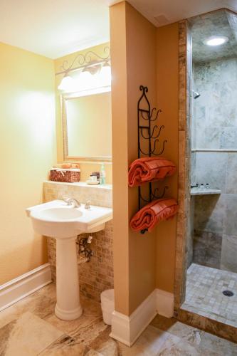 a bathroom with a sink and a shower at Iron Horse Inn in Granbury