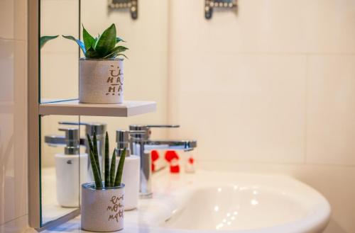 a bathroom with a sink and a mirror at Villa Ada Malinska in Malinska