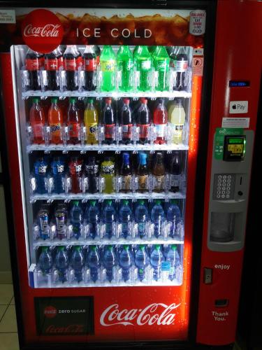 a cocacola ice cold vending machine filled with drinks at WeStay Suites - Covington/Mandeville in Covington