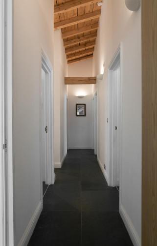 a hallway with white walls and a wooden ceiling at Chalet Marmotte 1 in Morzine