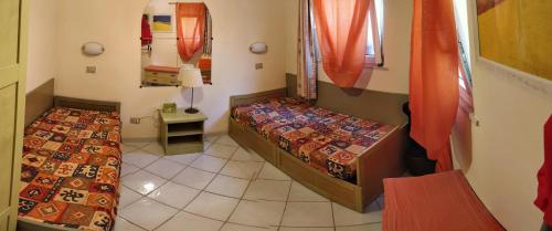 Posteľ alebo postele v izbe v ubytovaní Sardegna per 5