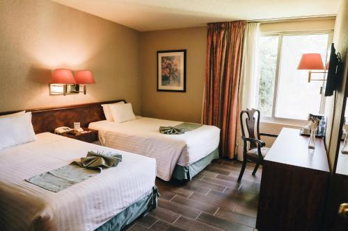 Katil atau katil-katil dalam bilik di Hotel La Joya Tulancingo
