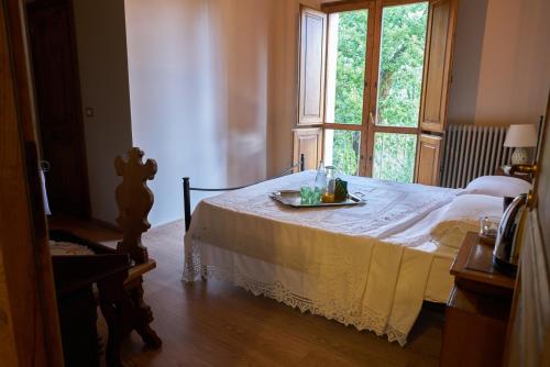 a bedroom with a bed with a tray on it at Masseria boutique b&b in Montella