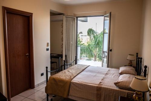 Postel nebo postele na pokoji v ubytování B&B Caravello