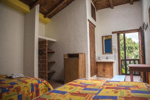 Postel nebo postele na pokoji v ubytování Rossco Hostel