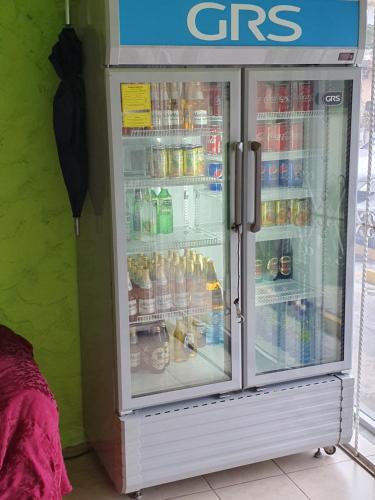 a refrigerator filled with lots of food and drinks at hotel kasa kamelot 2 in Quetzaltenango