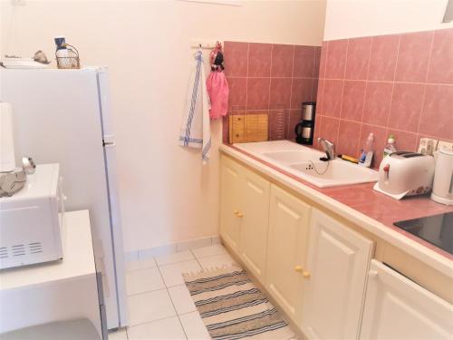 Η κουζίνα ή μικρή κουζίνα στο Cœur de Ville