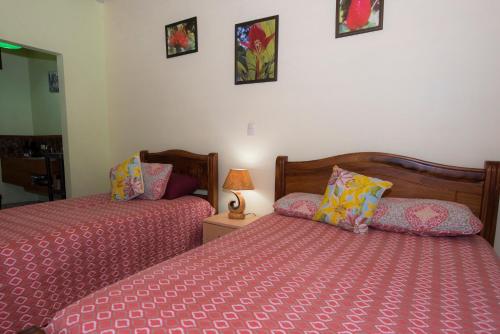 Hotel Sunshine Caribeにあるベッド