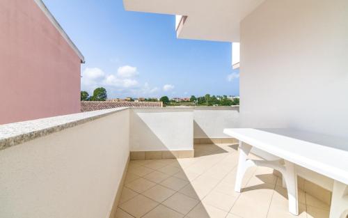 Un balcón o terraza de Appartamento Luigi climatizzato con veranda