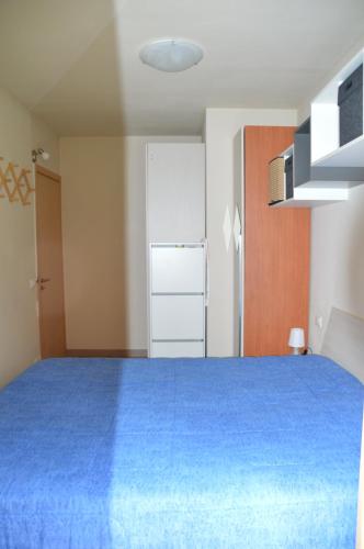 Ένα ή περισσότερα κρεβάτια σε δωμάτιο στο appartamento TOLLARINI Pontagna Temù Tonale