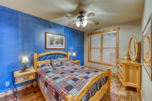 a bedroom with a bed and a ceiling fan at Corral at Breckenridge in Breckenridge