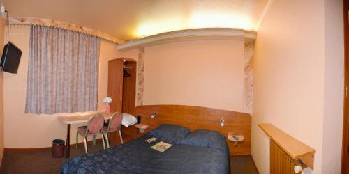 Katil atau katil-katil dalam bilik di Le Cheval Noir Hôtel Paris Pantin
