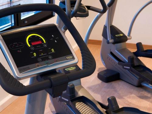 a tablet on a treadmill in a gym at Novotel Hamburg City Alster in Hamburg