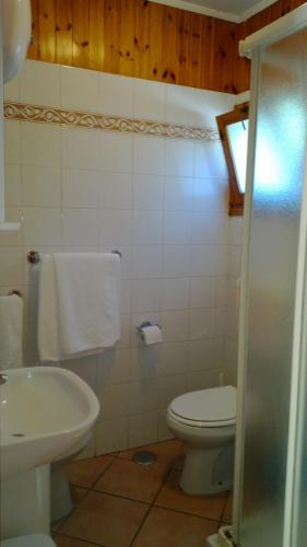 a bathroom with a toilet and a sink at Camping Nube D'Argento in Sorrento
