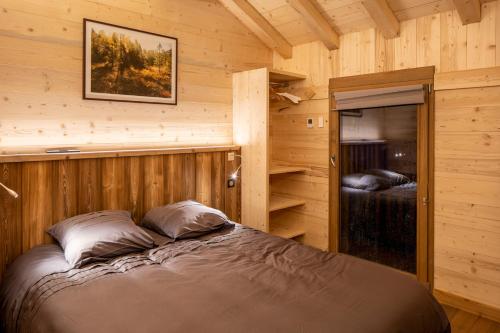 Postel nebo postele na pokoji v ubytování Chalet Horizon 180 4 étoiles Sauna