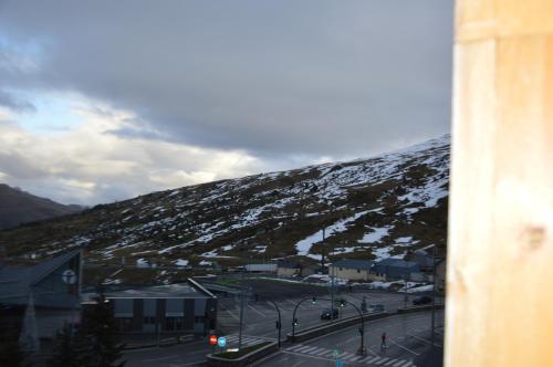 a view of a snow covered mountain with a street at Hotel Panda in Pas de la Casa