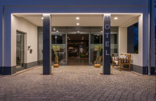 an entrance to a building with pumpkins in front of it at GERMANIA Wissen in Wissen