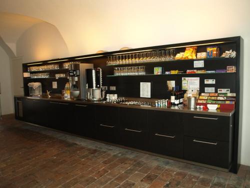 a bar in a restaurant with a counter at Schloss Puchberg in Wels