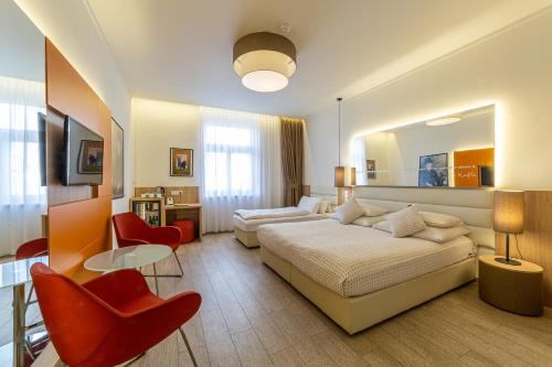 TV a/nebo společenská místnost v ubytování Salvator Boutique Hotel vegan-friendly