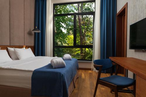 Кровать или кровати в номере Отель Полёт Чайки