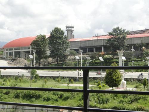 a view of a building from a window at Ganapati Airport Hotel in Kathmandu