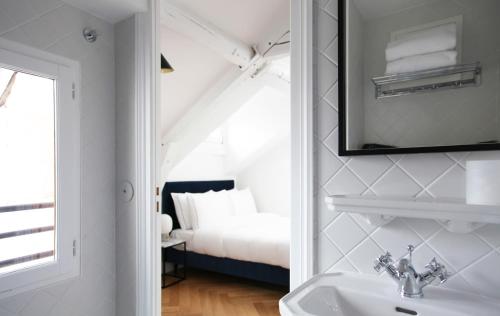 Krevet ili kreveti u jedinici u okviru objekta Hotel Rendez-Vous Batignolles