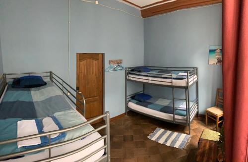 
a bedroom with a bed and a bunk bed at Johnson's house in Riga
