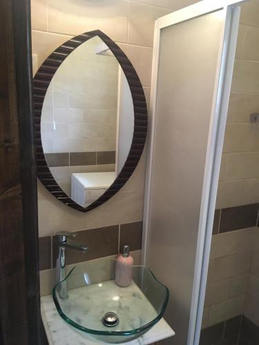a bathroom with a sink and a mirror at Veranda Vendégház in Verőce