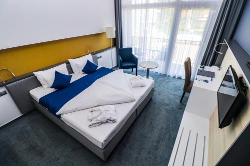Posteľ alebo postele v izbe v ubytovaní Hotel Yacht Wellness & Business