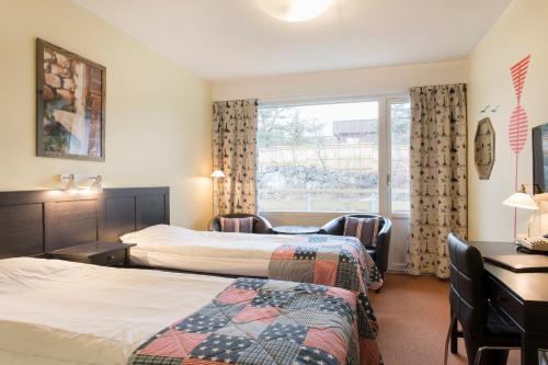 Postel nebo postele na pokoji v ubytování Skärgårdshotellet