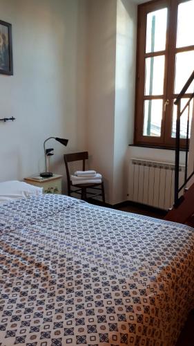 Postel nebo postele na pokoji v ubytování La Ginestra