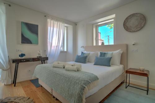 Postel nebo postele na pokoji v ubytování Urban Beach Estoril Apartment