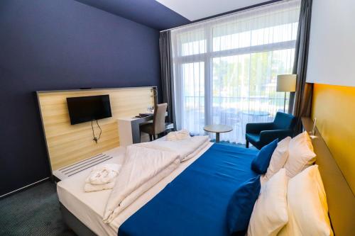 Posteľ alebo postele v izbe v ubytovaní Hotel Yacht Wellness & Business