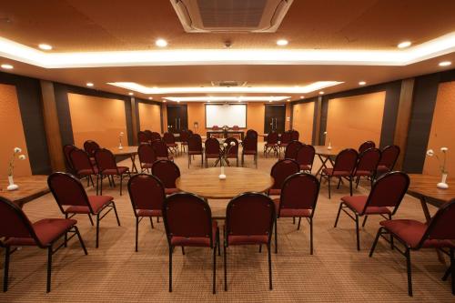 a conference room with tables and chairs in it at The Terrace by Ladder Mgd by Citrine in Trivandrum