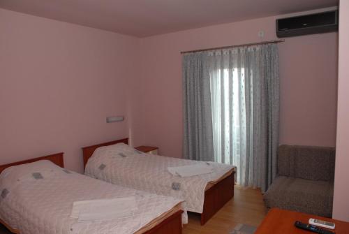 Un ou plusieurs lits dans un hébergement de l'établissement Harmony Hotel