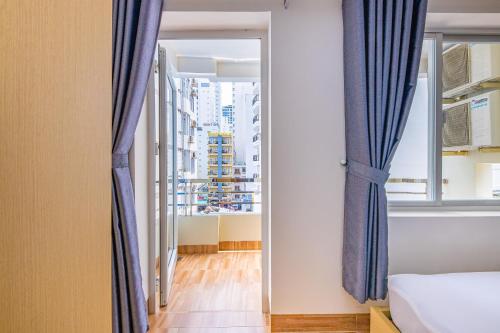 Postel nebo postele na pokoji v ubytování M&C Hotel Nha Trang