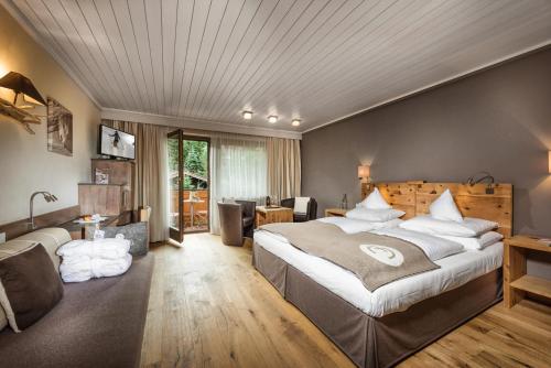 מיטה או מיטות בחדר ב-Alpin Juwel