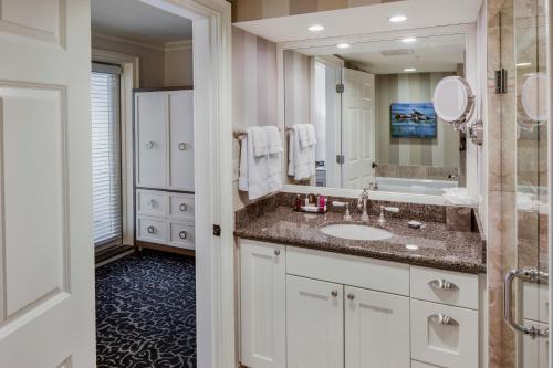 
a bathroom with a sink and a bathtub at Wentworth by the Sea, A Marriott Hotel & Spa in New Castle
