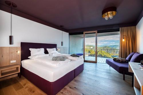 מיטה או מיטות בחדר ב-Hotel Belvedere - Fine Dining, Hideaway & SPA