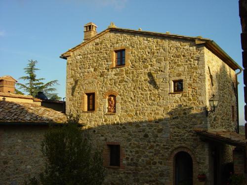 an old stone building with windows on top of it at Sant'Antonio in Volterra