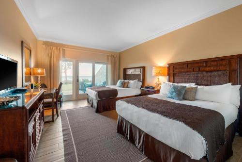 Ένα ή περισσότερα κρεβάτια σε δωμάτιο στο Villas Of Amelia Island