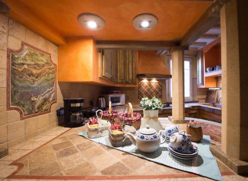 a kitchen with a table with baskets on it at Villa Dacia in Guiglia