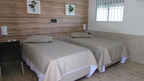 מיטה או מיטות בחדר ב-Resort Hotel Atlantic City Nautico Club