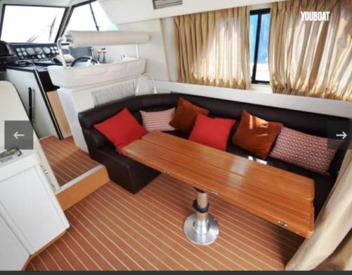 a view of a living room on a yacht at Beautiful Kiwi Boat in Barcelona