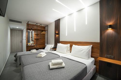 Postel nebo postele na pokoji v ubytování Argo Hotel Piraeus