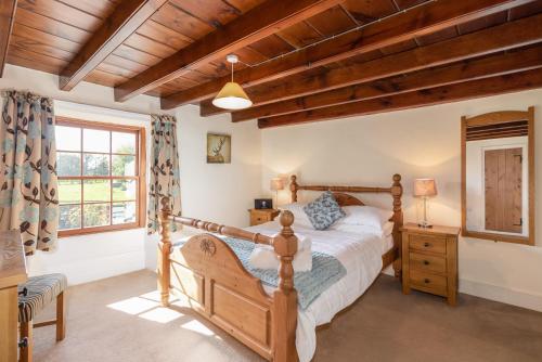 Postel nebo postele na pokoji v ubytování The Cottage Gillamoor